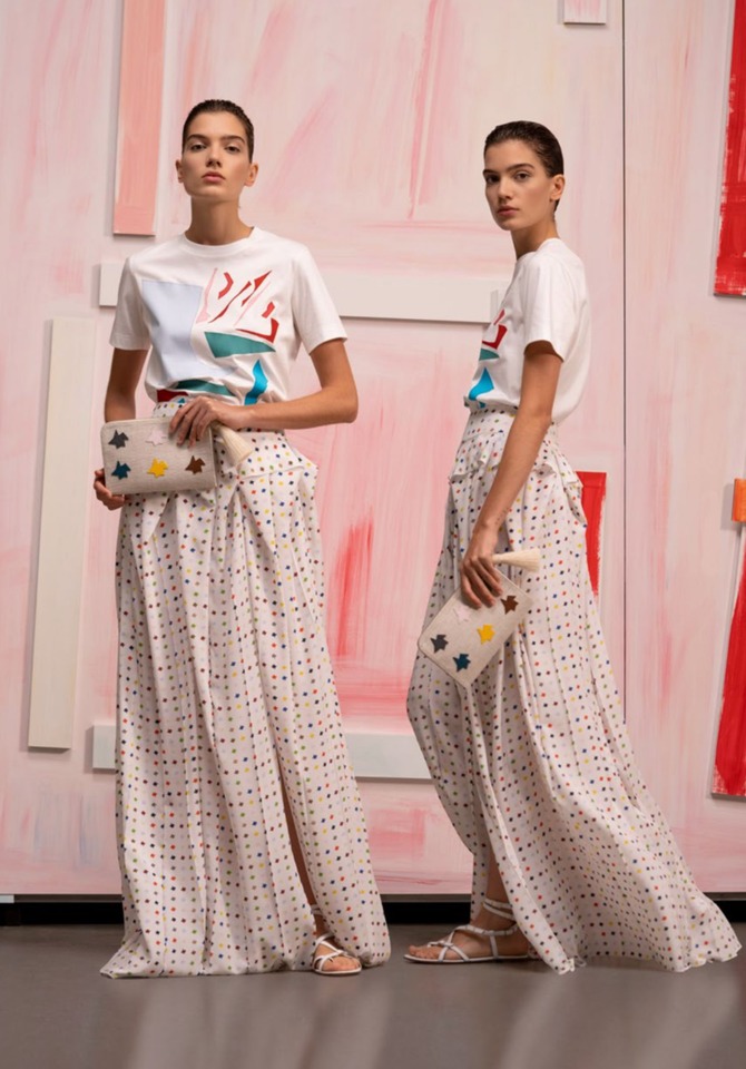 Lilola cotton voile cape style tunic blouse with asymmetrical hem, Ecru double-face linen wool crêpe cropped wide leg pant, Ai medium messenger bag in Cream raffia fabric