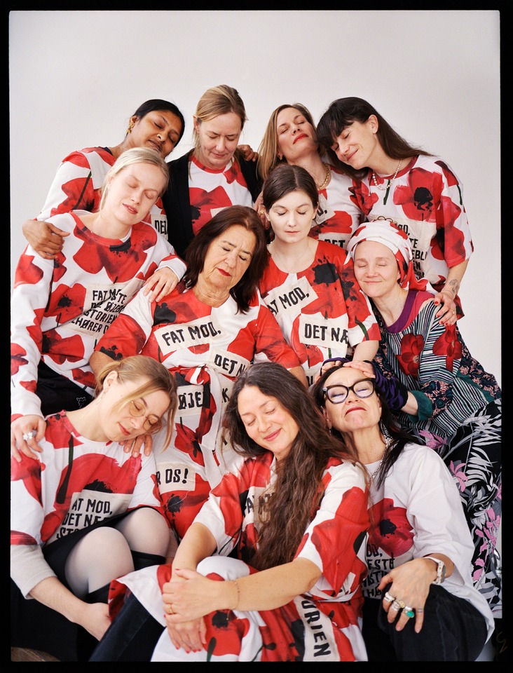 Ursula Reuter Christiansen, surrounded by 12 exceptional writers who were performing spoken words in the window of Nørgaard paa Strøget on International Women’s Day, March 8.