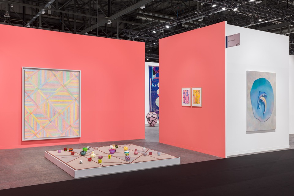 Solo booth by Karim Noureldin and on the right a painting by Francisco Sierra